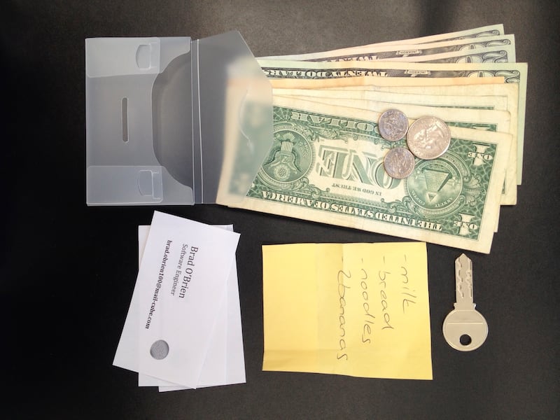 FILE - This undated photo provided by researchers in June 2019 shows an example of the contents of a transparent wallet used in an experiment to test how likely people are to return a lost wallet. "The evidence suggests that people tend to care about the