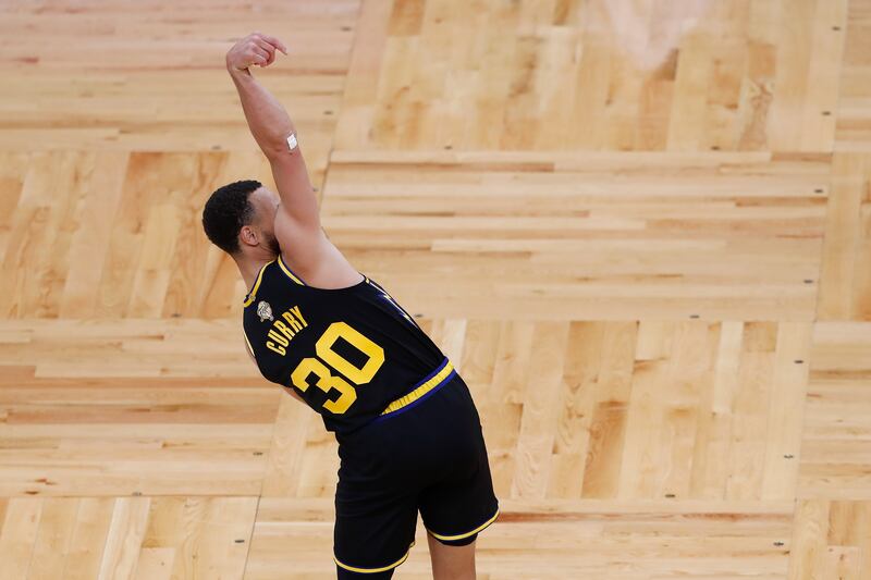Golden State Warriors guard Stephen Curry (30) follows through on a shot against the Boston Celtics during the second quarter of Game 4 of the NBA Finals