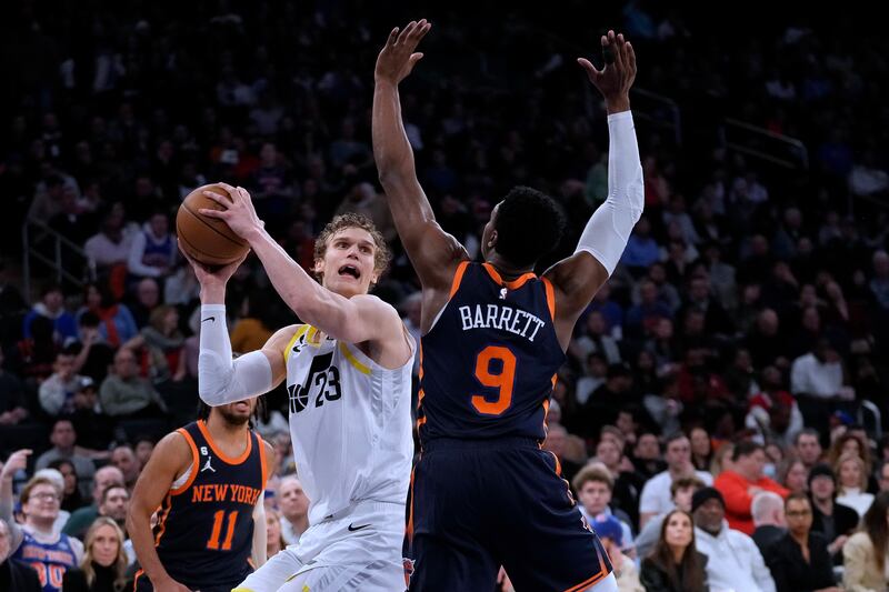 Utah Jazz forward Lauri Markkanen (23) looks for a shot against New York Knicks guard RJ Barrett (9) during the second half of an NBA basketball game Saturday, Feb. 11, 2023, in New York.