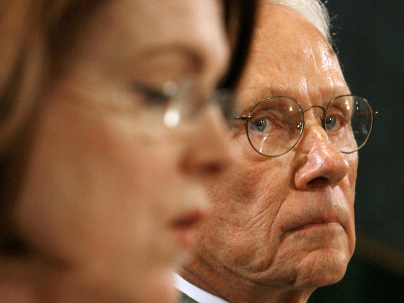FILE - In this April 11, 2007 file photo, Roger Sant, of the Board of Regents for the Smithsonian Institution, right, listens to fellow board member Patricia Stonesifer as she testifies on Capitol Hill in Washington. Sant and his wife Vicki are giving $10