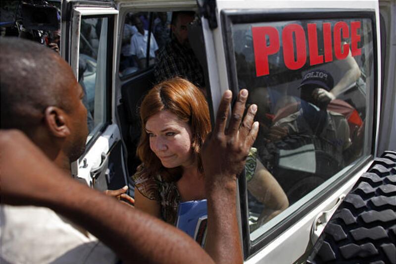 Laura Silsby exits a police car outside a courthouse in Port-au-Prince.