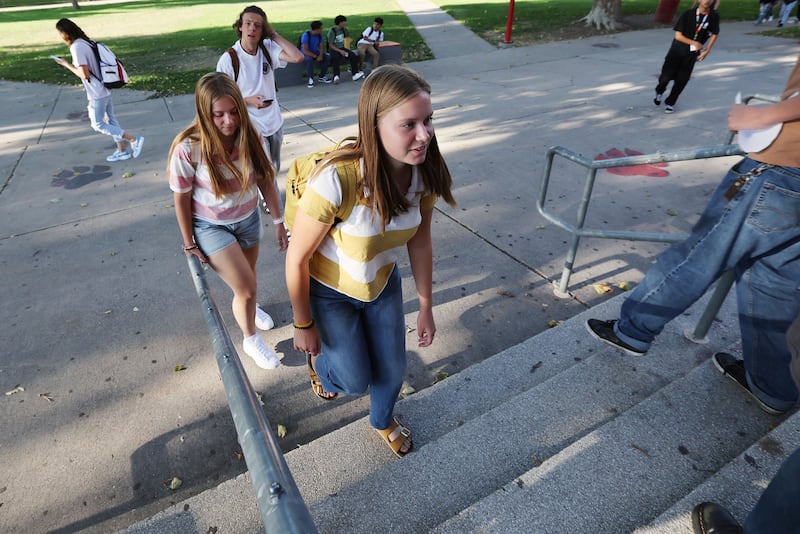 Carol and Audrey Kamerath walk into West High School in Salt Lake City, Utah.