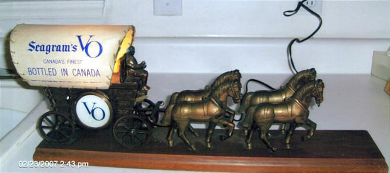 One version of this covered-wagon lamp was meant to sit on a television set, another was designed to provide illumination in a barroom.