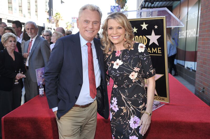 Pat Sajak, left, and Vanna White, from “Wheel of Fortune,” attend a ceremony honoring Harry Friedman with a star on the Hollywood Walk of Fame in Los Angeles.