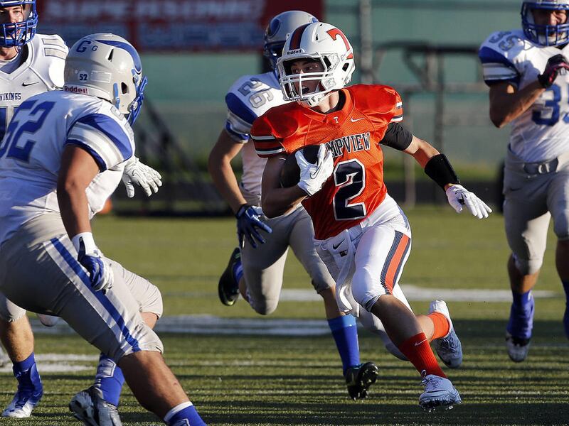 Britain Covey of Timpview runs the opening kickoff back for a touchdown against Pleasant Grove in high school football played in Provo, Friday, Aug. 30, 2013.