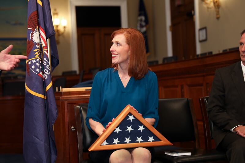 Between tears and smiles, Jennie Taylor, widow of former North Ogden mayor and major in the U.S. Army National Guard Brent Taylor who was killed in Afghanistan in November 2018, accepts a U.S. flag during a reception thrown in honor of her and her late h