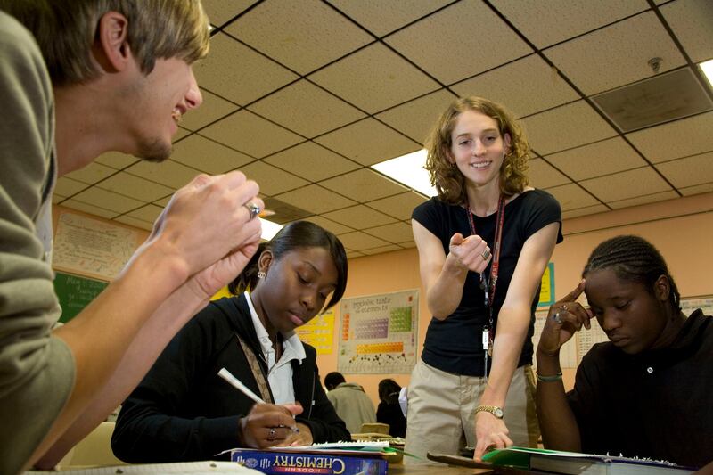2005 Teach for America corps member Jennifer Walcott during a class exercise with her students at East St. John High School in New Orleans.