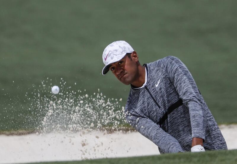 Tony Finau hits from a bunker on the second hole during the fourth round at the Masters golf tournament Sunday, April 8, 2018, in Augusta, Ga.