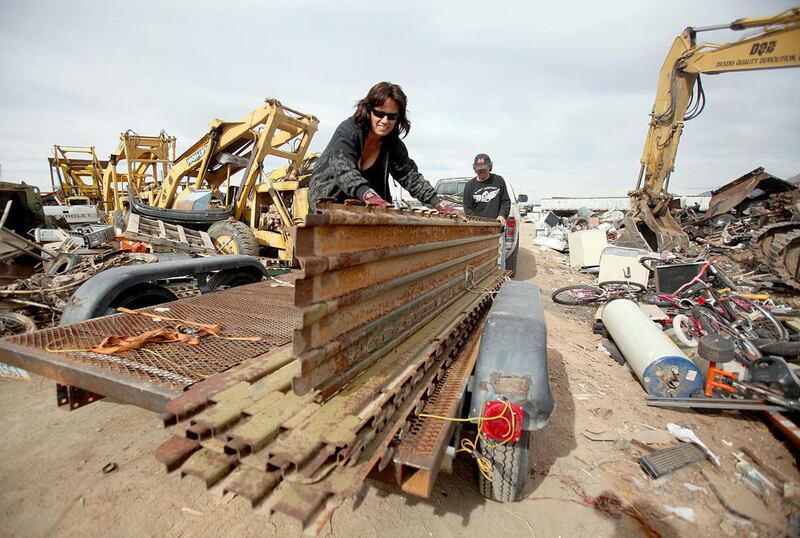 In this Jan. 25, 2012 photo, Sueann Engle and Paul Shideler are the owners of Complete Property Cleaners and sell scrap metal at Scrap Metals Recycling in Tucson, Ariz. Local authorities hope a new investigative tool will help them to battle the stubbo