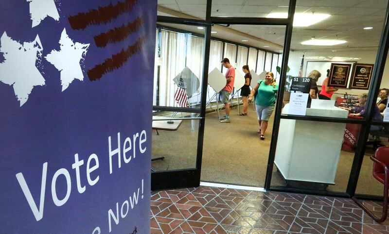 FILE - Citizens cast their ballots at the Salt Lake County Government Center on Election Day Tuesday, June 26, 2018.