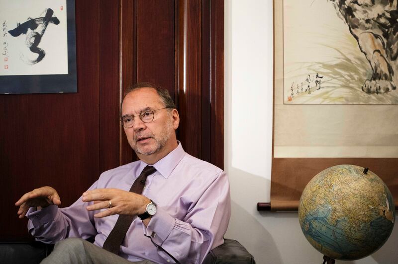 FILE- In this Oct. 17, 2014, file photo, Dr. Peter Piot, director of the London School of Hygiene and Tropical Medicine, speaks during an interview with The Associated Press at his office in London. Piot, was was the co-discoverer of the Ebola virus, questioned why it took the World Health Organization five months and 1,000 deaths before the agency declared Ebola an international health emergency in August. (AP Photo/David Azia)