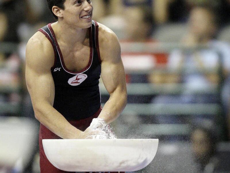 FILE - In this Aug. 14, 2009, file photo, David Sender chalks his hands on the second day of the men's competition at the U.S. gymnastics championships, Friday, Aug. 14, 2009, in Dallas. Sender figured he'd moved on from the bitter disappointment of 2008,