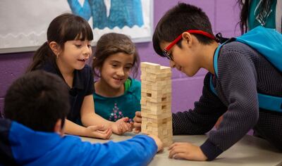 Alex R., Sofia R., Time A., and Cesar O. play Jenga at the Lied Boys and Girls club in Salt Lake City on Wednesday, Dec. 5, 2018. On Dec. 12, the George S. and Dolores Dore Eccles Foundation will commemorate 60 years and over $600M in philanthropy with a