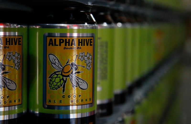 Cans of spring seasonal Alpha Hive Double IPA are ready to be filled with beer at COOP Ale Works in Oklahoma City, Friday, Jan. 18, 2019. America’s drinking habits vary depending on which religious group they belong to, according to a new report from the