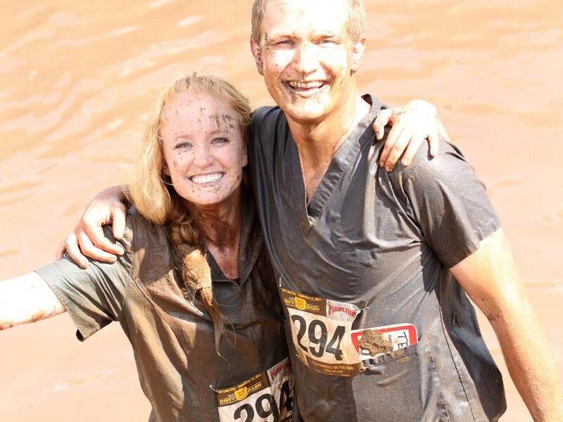 Amelia Nielson-Stowell and brother Trent Nielson jump in the mud pit during the Dirty Dash, a 10k mud run in Soldier Hollow.
