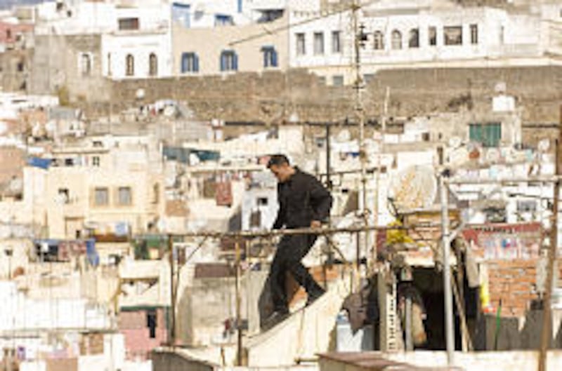 Jason Bourne (Matt Damon) chases his quarry across rooftops in Tangier in the espionage thriller that takes Bourne back home.