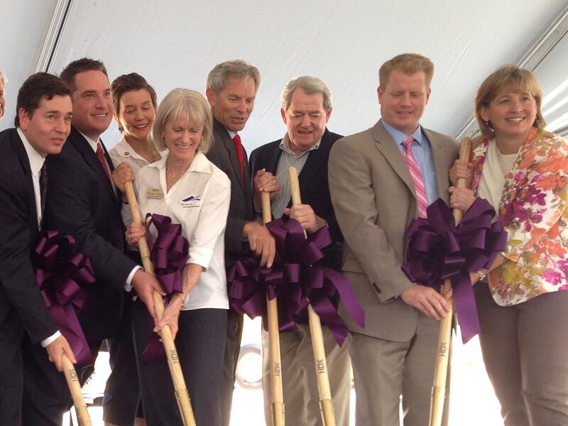 Natalie Gochnour, right, helps break ground on the new Salt Lake City International Airport construction. Because the airport saved money for the rebuild, secured FAA grants, and negotiated gate fees and royalties with the airline and car rental companies