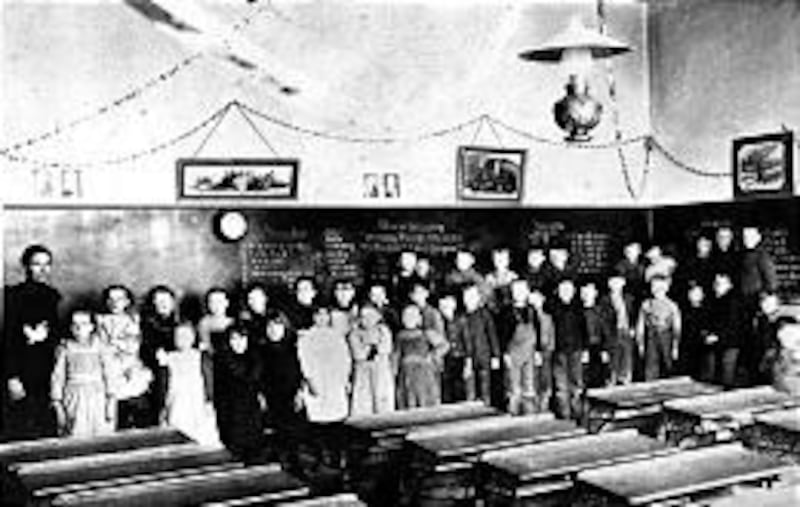 Students line up in an old LDS academy in the early 1900s, before public education had the hold it does now.