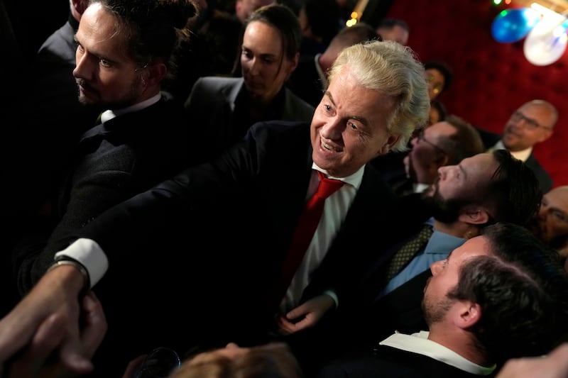 Geert Wilders, leader of the Party for Freedom, known as PVV, smiles after announcement of the first preliminary results of general elections in the Netherlands, on Nov. 22, 2023.