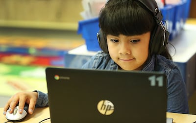 Oquirrh Elementary School student Chelsee DeLa Rosa reads in Kearns on Wednesday, July 18, 2018.