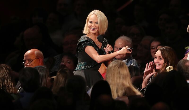 Kristin Chenoweth talks with audience members while singing with the Tabernacle Choir at Temple Square during their opening Christmas concert in Salt Lake City on Thursday, Dec. 13, 2018.