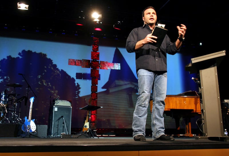 ** ADVANCE FOR FEB. 17-18 WEEKEND EDITIONS ** Mars Hill Church Lead Pastor Mark Driscoll, 36, preaches during an evening service on Sunday Feb. 11, 2007 at the church's flagship black warehouse in Seattle's trendy Ballard neighborhood, and the services ar