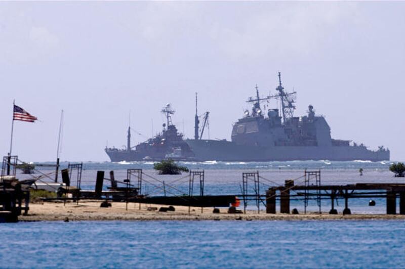 The USS Port Royal, a Navy guided missile cruiser, sits grounded atop a reef about a half-mile south of the Honolulu airport's reef runway Friday. The Navy said Sunday its third attempt to free the ship, which ran aground Feb. 5, has failed. Pacific Fleet