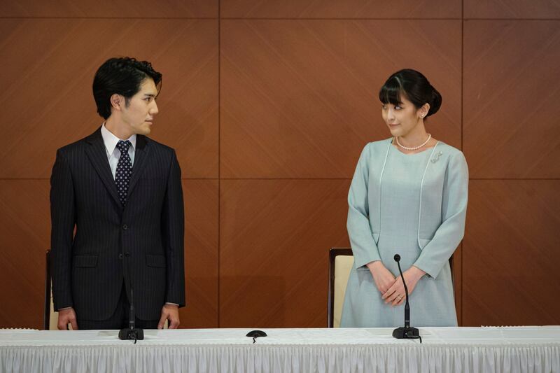 Japan’s former Princess Mako, with her husband Kei Komuro, pose during a press conference to announce their marriage.