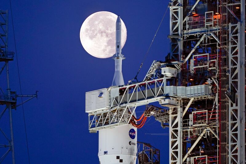 The strawberry supermoon over the NASA Artemis rocket with the Orion spacecraft aboard at the Kennedy Space Center.