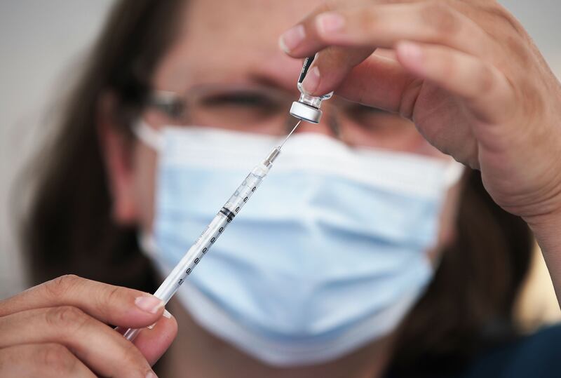 Clarece Glanville prepares a COVID-19 vaccination at pop-up clinic sponsored by the Davis County Health Department.