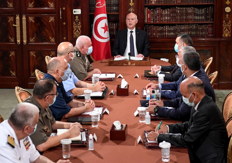 Tunisia President Kais Saied with members of the army and police forces in Tunis, Tunisia.