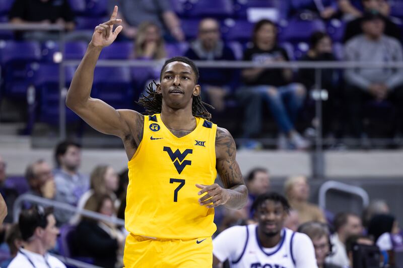 West Virginia guard Javon Small celebrates after making a 3-point shot against TCU in Fort Worth, Texas, Wednesday, Feb. 5, 2025. Small has played big for the Mountaineers this season, which host BYU on Tuesday night Morgantown.