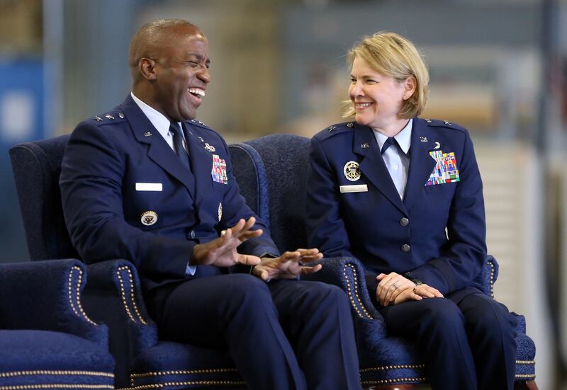 Maj. Gen. Stacey T. Hawkins and Brig. Gen. C. McCauley von Hoffman share a laugh as von Hoffman takes command of the Ogden Air Logistics Complex from Hawkins during a ceremony at Hill Air Force Base near Ogden on Friday, July 19, 2019.