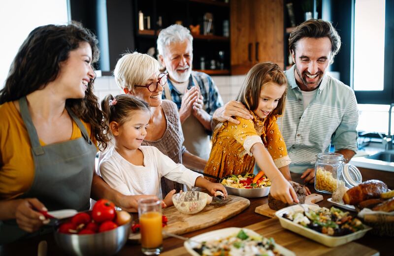 A family eats dinner together.