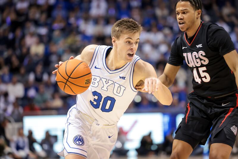BYU guard Dallin Hall drives against Gonzaga guard Rasir Bolton during game at the Marriott Center in Provo, Jan. 12, 2023.