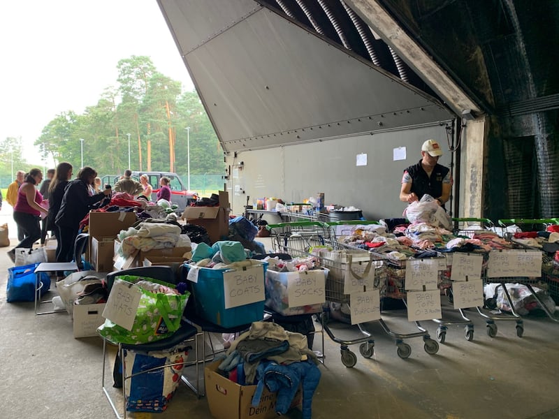 Volunteers at Ramstein Air Base in Germany organize items for Afghan refugees donated by Latter-day Saint Charities.