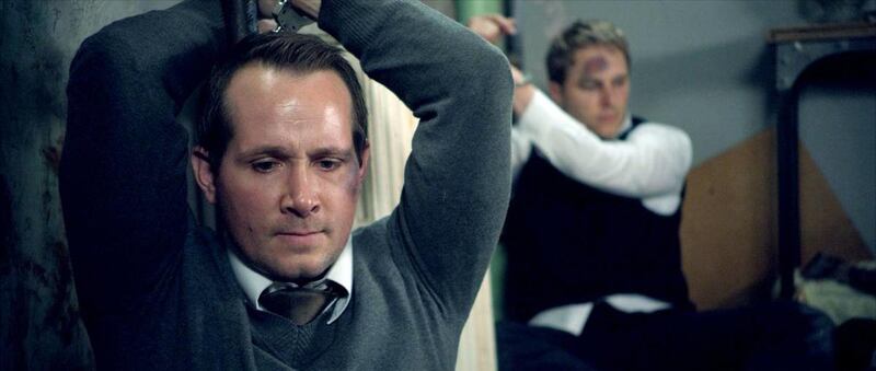 Missionaries Travis Tuttle (Corbin Allred) and Andrew Propst (Maclain Nelson) are held captive in "The Saratov Approach."