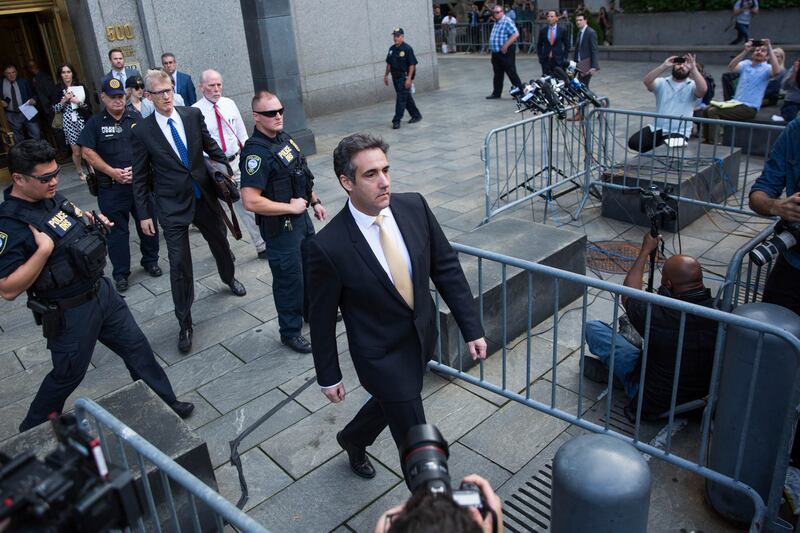 Michael Cohen, former lawyer to President Donald Trump, departs following his appearance in Federal Court on Tuesday, Aug. 21, 2018, in New York. Cohen, has pleaded guilty to charges including campaign finance fraud stemming from hush money payments to po
