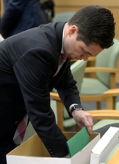 Deputy Cache County attorney Spencer Walsh gets documents out of a box before Torrey Green's rape trial in 1st District Court in Brigham City on Tuesday, Jan. 15, 2019. Green is accused of raping multiple women while he was a football player at Utah State