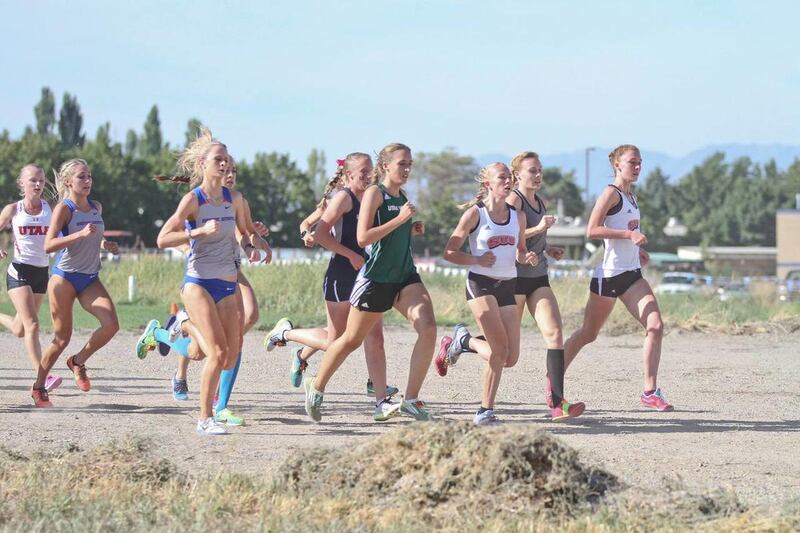 Utah Valley women's cross-country junior McKayla Morgan (center) tries to break from a pack of runners at the Utah State Sagebrush Invitational. Morgan placed second Saturday at the Southern Utah University Color Country Invitational.