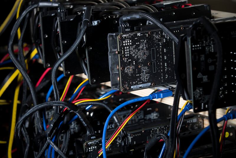 Jacob Berezay's Ethereum mining station is set up with 26 graphics cards in South Salt Lake on Thursday, Dec. 28, 2017.