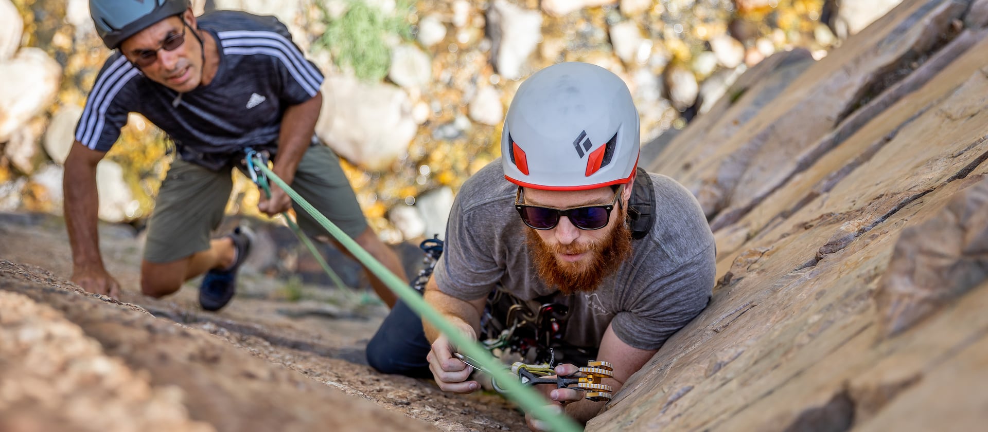 Quino Gonzalez, a guide and instructor for Utah Mountain Adventures, supervises while Daman Bareiss places protection during a trad climbing clinic in Big Cottonwood Canyon.