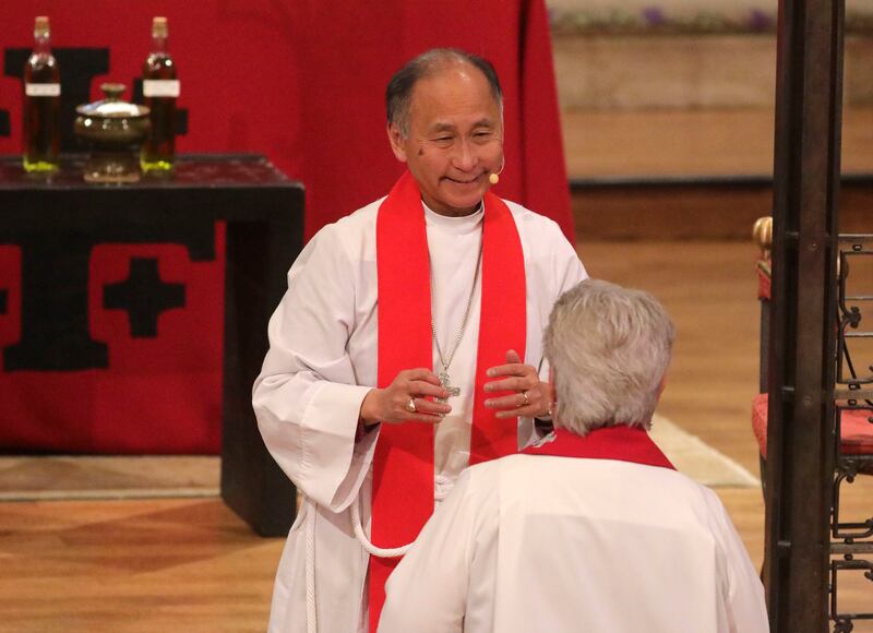 Bishop Scott Hayashi prepares to bless a woman during the Holy Eucharist with Consecration of Chrism and Renewal of Vows service at the Cathedral Church of St. Mark in Salt Lake City on Tuesday, April 16, 2019.