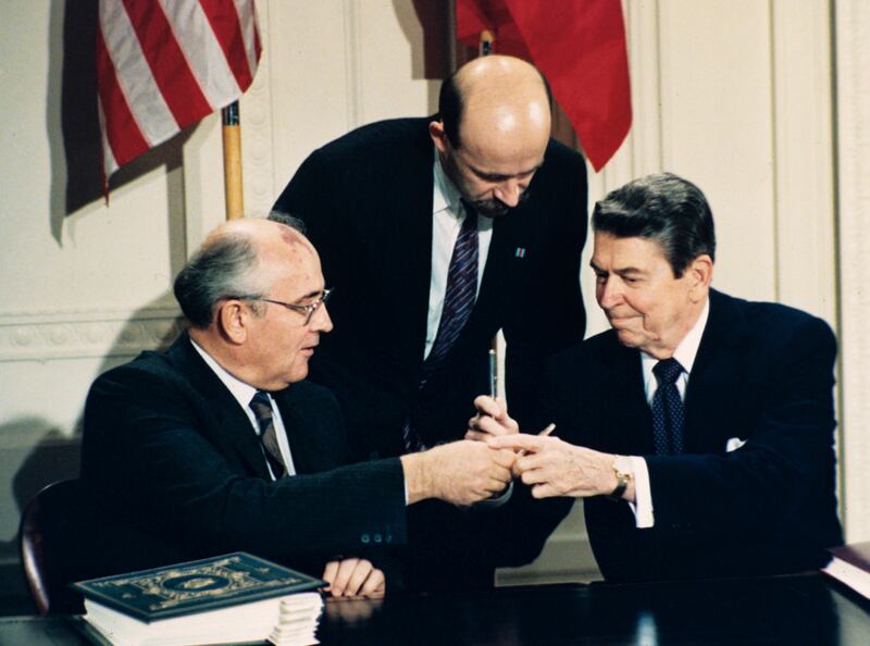 FILE - In this Dec. 8, 1987 file photo U.S. President Ronald Reagan, right, and Soviet leader Mikhail Gorbachev exchange pens during the Intermediate Range Nuclear Forces Treaty signing ceremony in the White House East Room in Washington, D.C. Gorbachev's