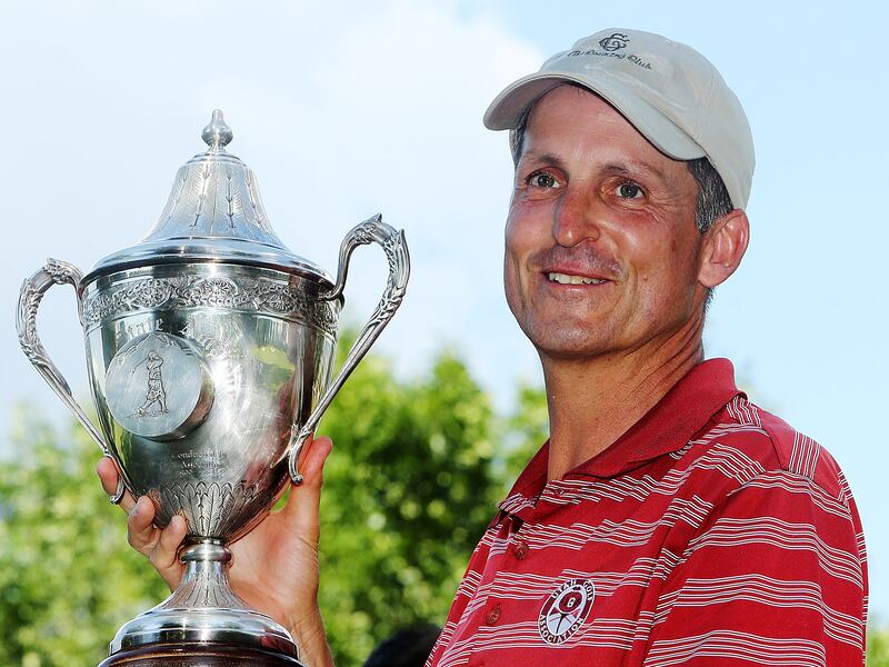 Jon Wright holds up the trophy after winning the Utah State Amateur in 2014.