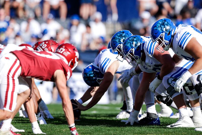 BYU linemen prepare for a snap during game against Arkansas last year in Provo.