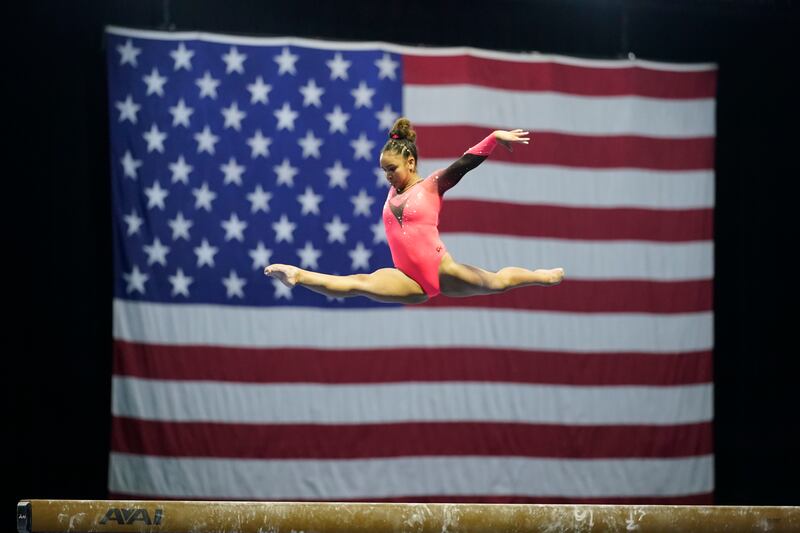 Konnor McClain performs on the balance beam during the Winter Cup.