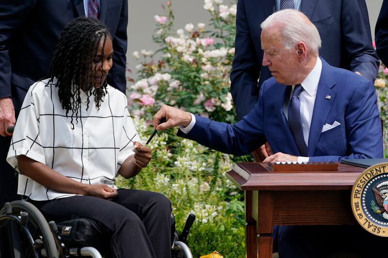 President Joe Biden marks the 31st anniversary of the Americans with Disabilities Act with artist Tryee Brown.
