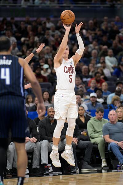 Cleveland Cavaliers guard Sam Merrill (5) shoots a 3-pointer during the first half of an NBA basketball game against the Orlando Magic, Monday, Jan. 22, 2024, in Orlando, Fla.