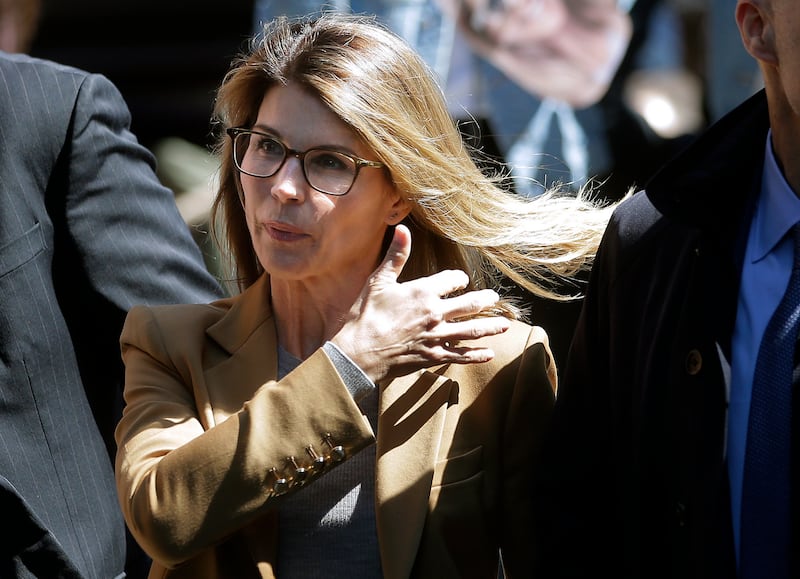 Actress Lori Loughlin arrives at federal court in Boston on Wednesday, April 3, 2019, to face charges in a nationwide college admissions bribery scandal.